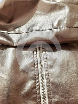 Metallic silver fragment of jacket, zipper. Background design, photography. Textile, fabric template, modern new