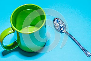 Spoon and cup with microplastics