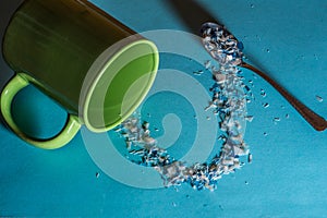 Spoon and cup with microplastics