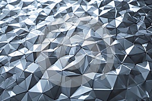 Dynamic abstract geometric metallic surface reflecting light with sharp edges and facets