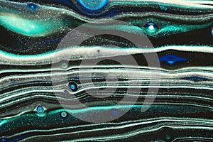 Metallic teal layers with black and white in this abstract painting for backgrounds.