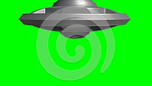 Metallic UFO alien spaceship flying isolated on green background