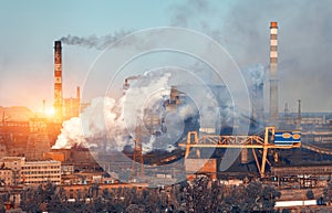 Metallurgy plant in Ukraine at sunset. Steel factory with smog