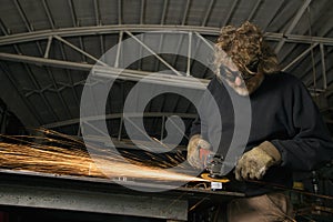 Metalsmith creating sparks.