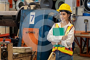 Metalwork manufacturing factory inspection with female engineer. Exemplifying