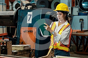 Metalwork manufacturing factory inspection with female engineer. Exemplifying