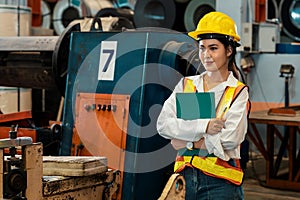 Metalwork manufacturing factory inspection with female engineer. Exemplifying