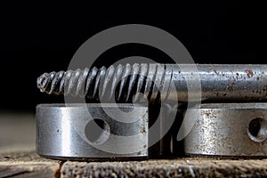 Metalwork tools on the workshop table. Threading dies and taps i