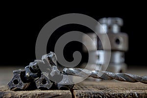 Metalwork tools on the workshop table. Threading dies and taps i