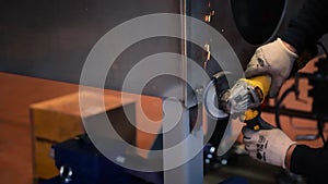 Metalworker at work with his grinder