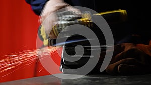 Metalworker at work with his grinder