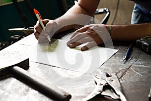 Metalworker working on a project photo