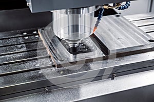 Metalworking CNC milling machine. Cutting metal modern processing technology. photo