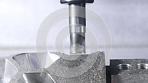 Metalworking cutting process by milling cutter. Media. CNC machine processes metal detail. Close-up of the metal