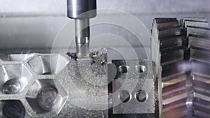 Metalworking cutting process by milling cutter. Media. CNC machine processes metal detail. Close-up of the metal