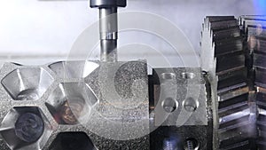 Metalworking cutting process by milling cutter. Media. CNC machine processes metal detail. Close-up of the metal