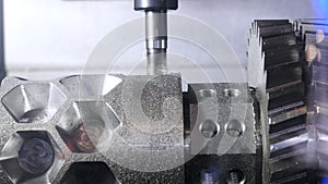 Metalworking cutting process by milling cutter. Media. CNC machine processes metal detail. Close-up of the metal