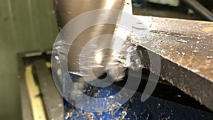 metalworking.The end milling cutter processes the part in machine hoists on a universal vertical milling machine . slow