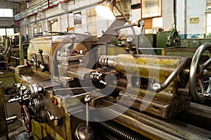 Metalworking workshop, metal processing machines. Levers of control of the machine.