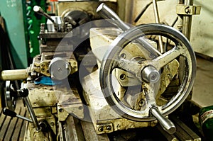 Metalworking workshop, metal processing machines. Levers of control of the machine. photo