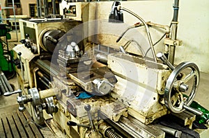 Metalworking workshop, metal processing machines. Levers of control of the machine.