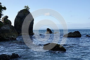 Rocks seen from the Las Galeras Beach, Samana, Dominican Republic photo