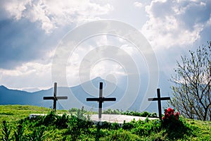 Metaphor of death and oblivion, tombs with crosses on top of a hill