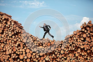 Metaphor - running business Man on his way to the top