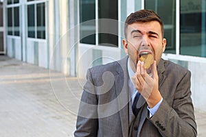 Metaphoric image of abused businessman at work
