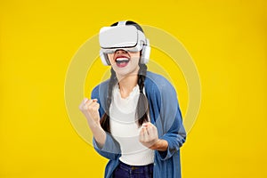 Metaverse Concepts, Asian woman in vr glasses isolated yellow background, playing games with virtual reality headset