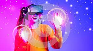 Metaverse technology. Asian woman wear vr goggles headset touching, looking, connecting digital virtual reality world
