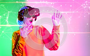 Metaverse technology concept. Asian girl wearing vr goggles headset watching playing connecting to digital virtual world