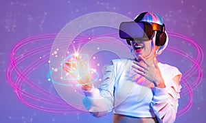 Metaverse technology concept. Asian woman in white t shirt wearing VR headset scanning fingerprint to connect world virtual data