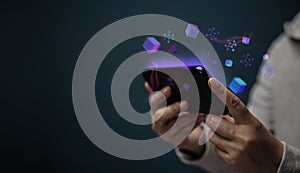 Metaverse, Web3 and Blockchain Technology Concepts. Closeup of Hand Using Smartphone for Connect a Community or Playing Game