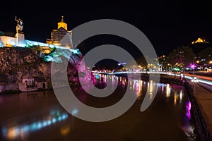 Meteki church with river in front in tiflis at night photo