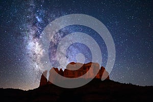 A meteor streaks through the Milky Way above Cathedral Rock in Sedona, Arizona. photo