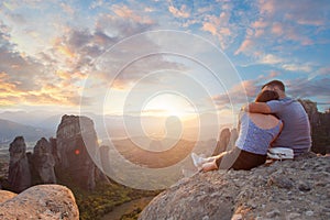 Meteora, Kalabaka Greece. Tourists couple enjoying a sunset in Meteora