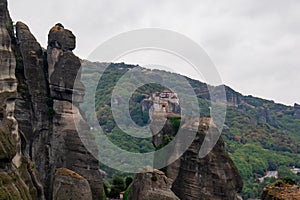 Meteora - Panoramic view on cloudy day of Holy Orthodox Monastery of Rousanou (St. Barbara), Kalambaka, Meteora, Greece.