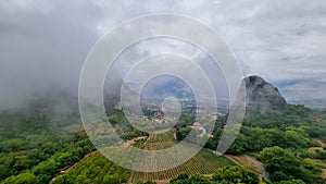 Meteora - Panoramic view on foggy day of Holy Orthodox Monastery of Rousanou (St. Barbara), Kalambaka, Meteora, Greece.