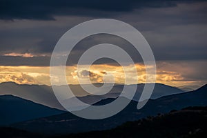 Meteora - Panoramic view during sunset from Meteora rocks to Pindos mountains, Thessaly district, Greece.