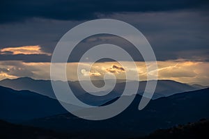 Meteora - Panoramic view during sunset from Meteora rocks to Pindos mountains, Thessaly district, Greece.