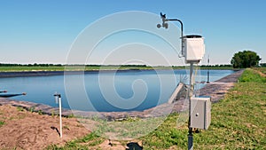 Meteorological instrument. A small weather station on a farm field, near the irrigation tank. The concept of smart