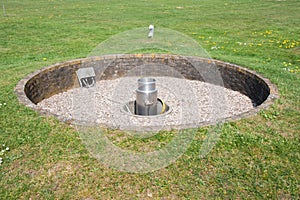 Meteorological rain gauge in open field photo