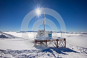 Meteorological station on top of mountain on winter resort photo