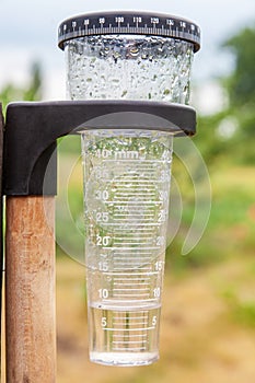 Meteorology with rain gauge in garden