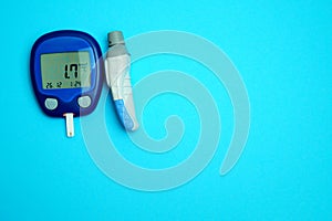 The meter is blue with very low sugar (hypoglycemia) on a white background. Copy space.