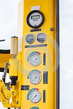 Meters or gauge in crane cabin for measure Maximun load, Engine speed , Hydraulic pressure , Temperature and fuel level
