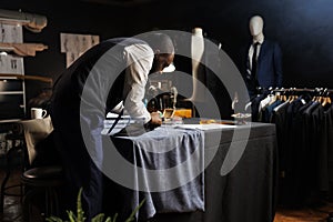 Suitmaker perfecting comissioned suit photo