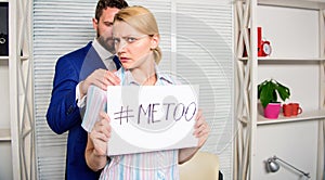 Metoo as a new movement. Manager putting his hand on the shoulder of his secretary, at the office. Office colleagues