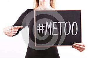 ` METOO` text in woman`s hands. Female empowering movement concept.